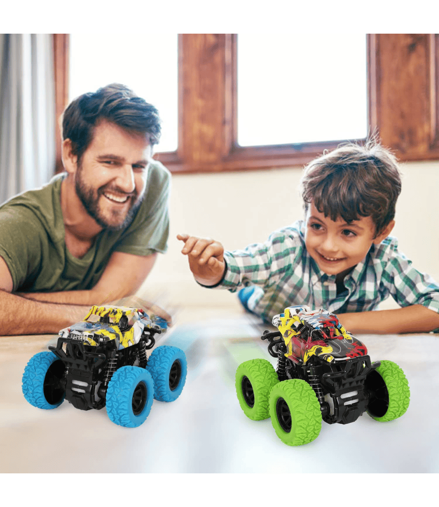 Hijo jugando con su papi con el coche monster truck.